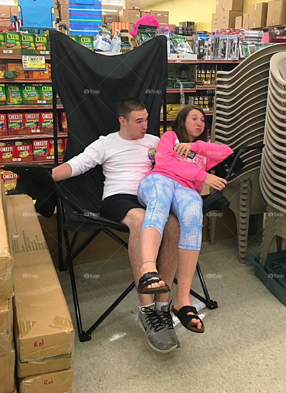 Sibling silliness - sitting in a giant chair together in a local store.  They were having fun. 😄