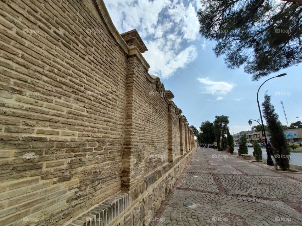Street walk to the tomb of Hafiz the sixth-century Persian poet Shiraz with old walls, with flow and flooring
