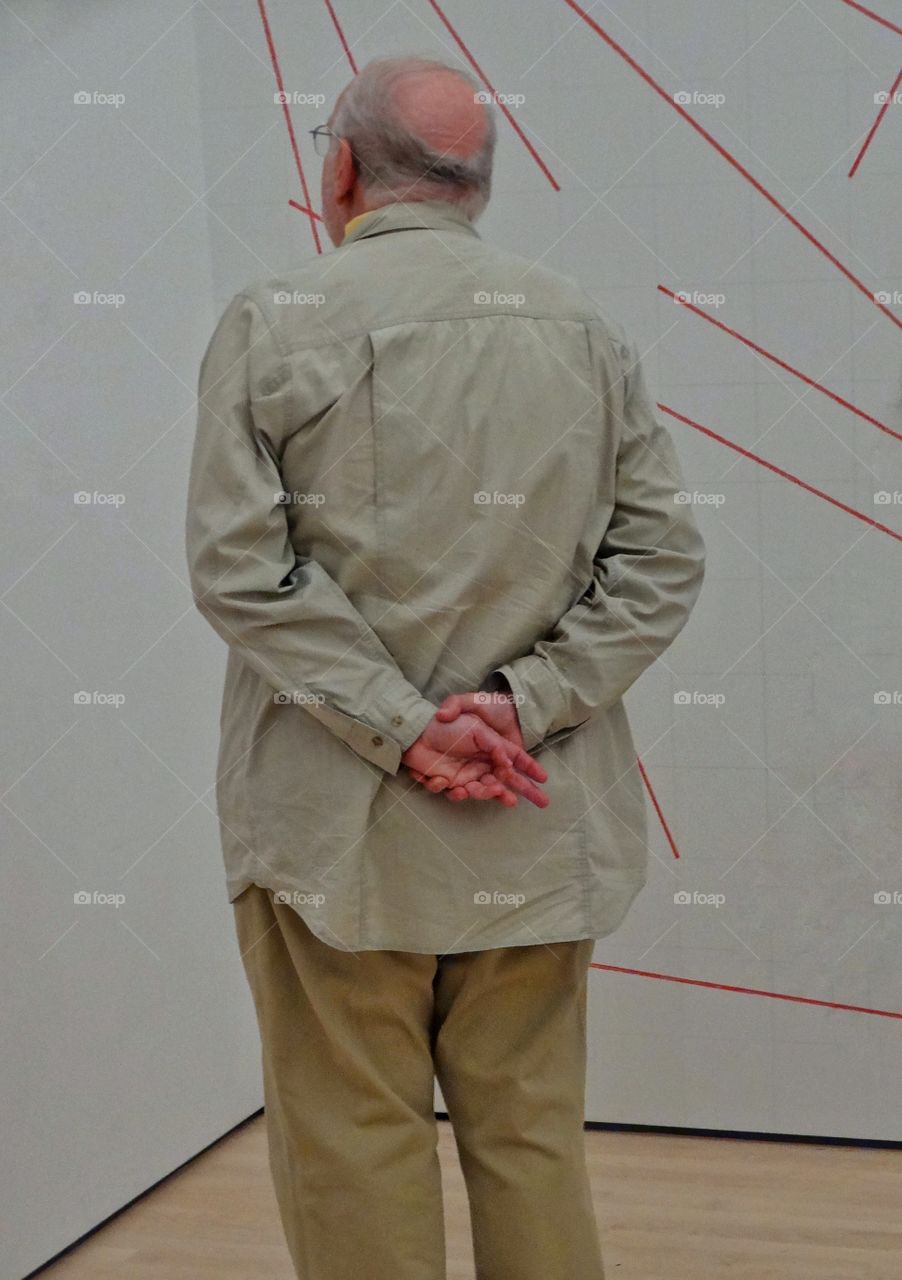 Older Man In An Art Gallery