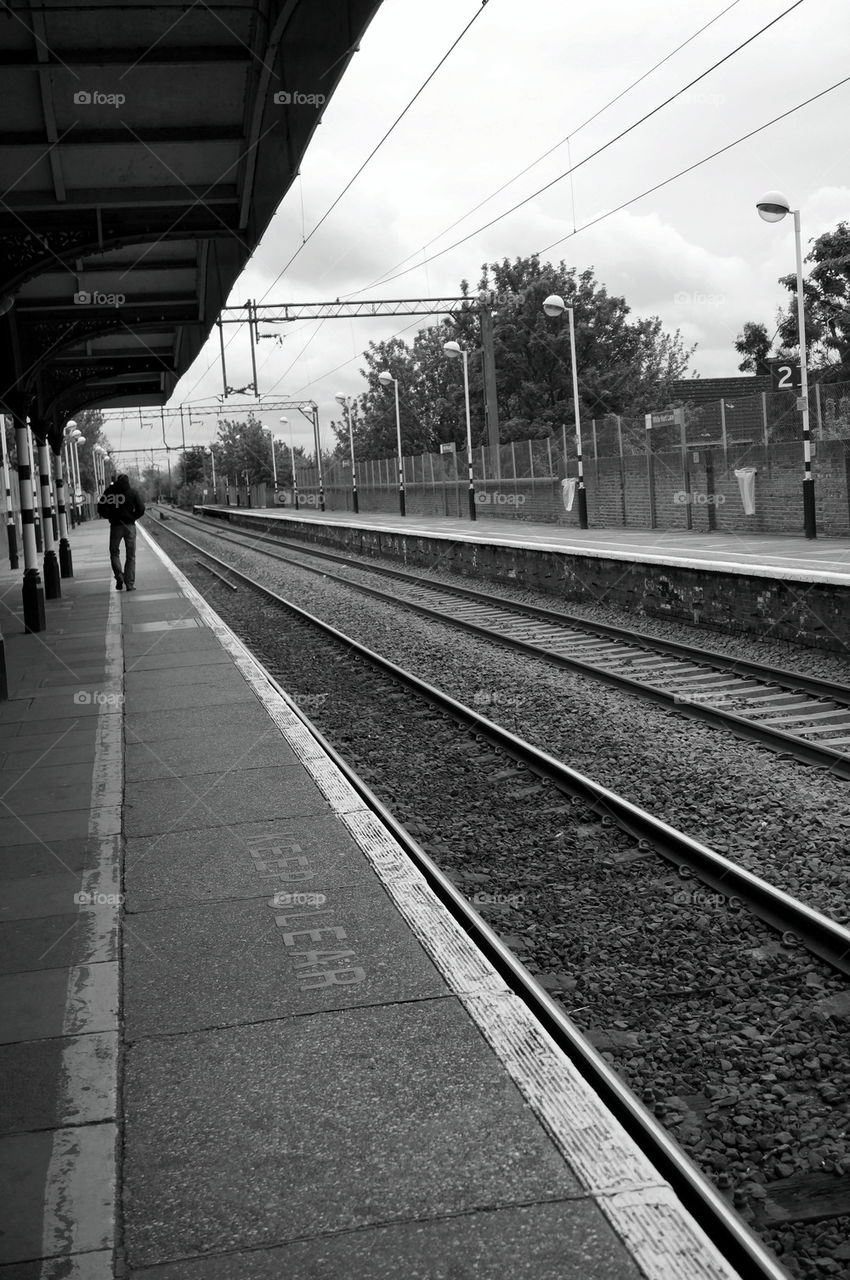 Man and railway tracks