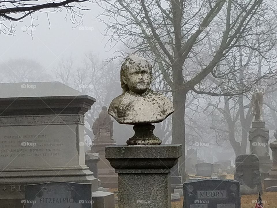 foggy morning cemetery bust