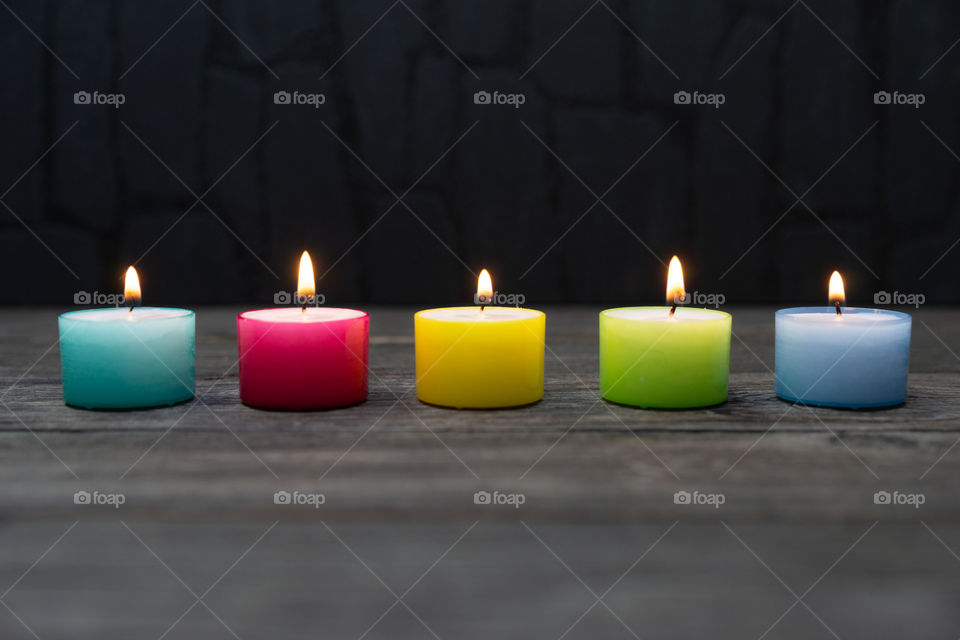 colorful tea light candles in a line