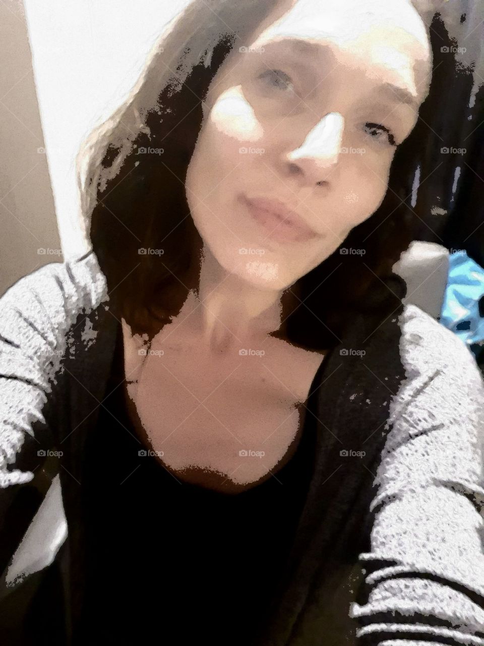 hello foap here i am again. smiling looking into the camera.