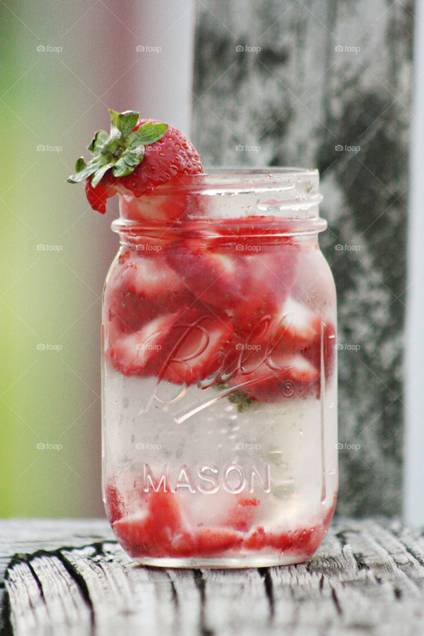 Strawberries fresh in a glass of water