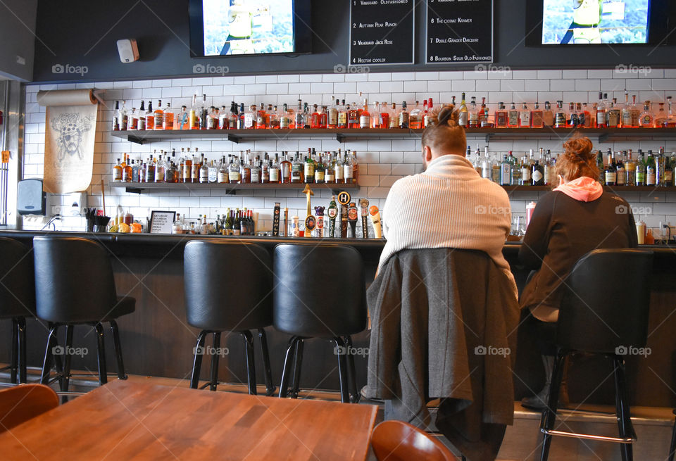 Couple sitting at a bar