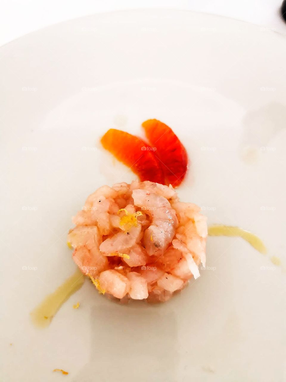 Pineapple mug with cottage cheese and shrimps on a white plate