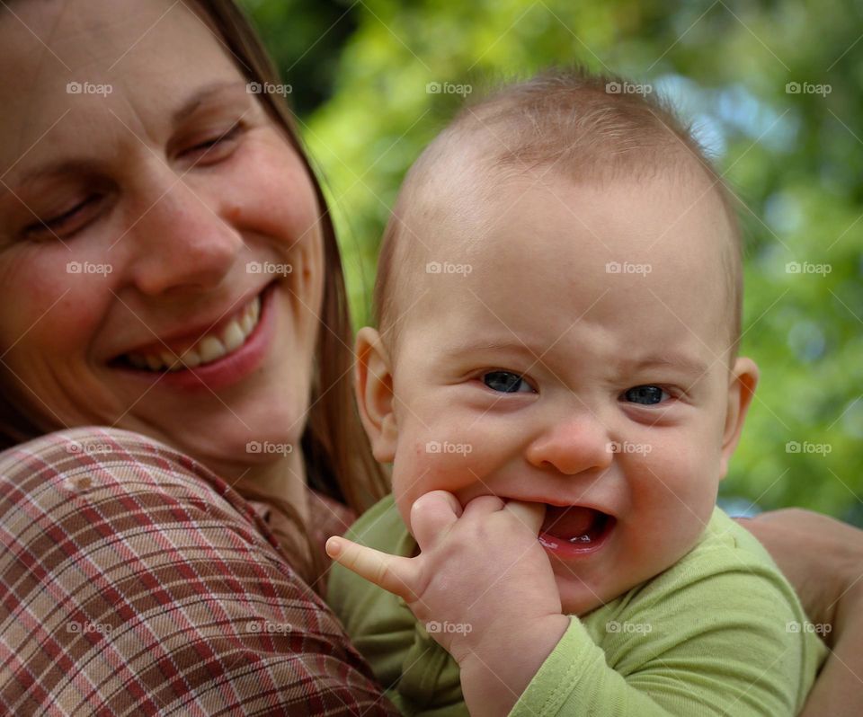 Portrait of a baby in mother's hands