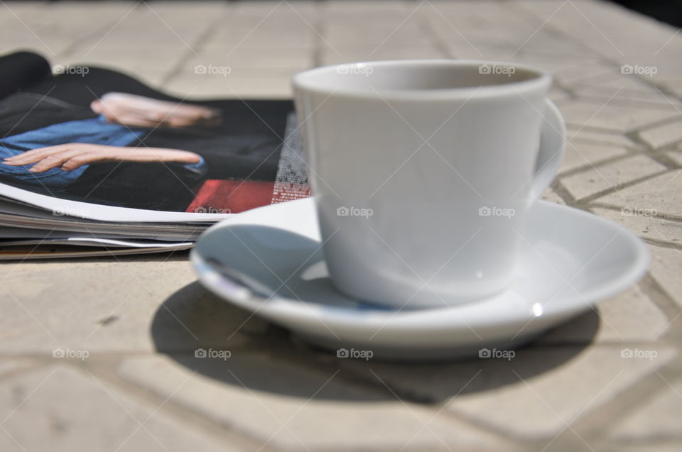 peefect break with cup of espresso and a magazine