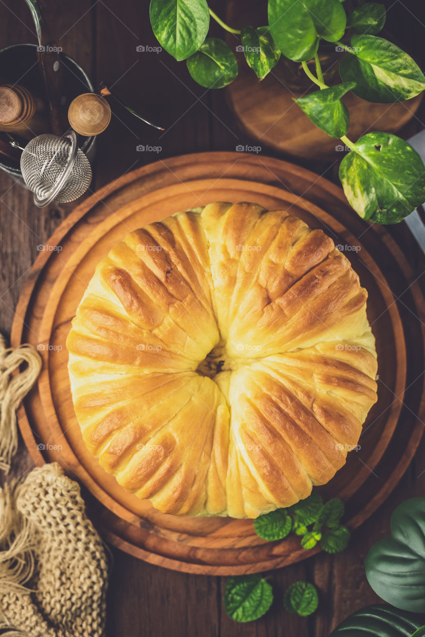 Delicious bread fresh from the oven, with beautiful texture on top part, served on the table