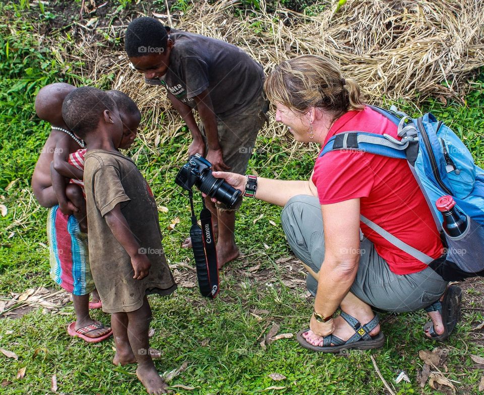 Photographed. These African children from a rural village in Uganda were being shown photographs of themselves.