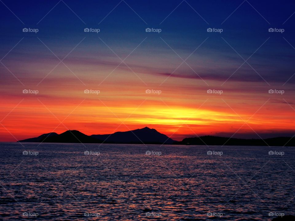 Sunset over Island of Ischia seen from Bagnoli ( Naples - Italy ).