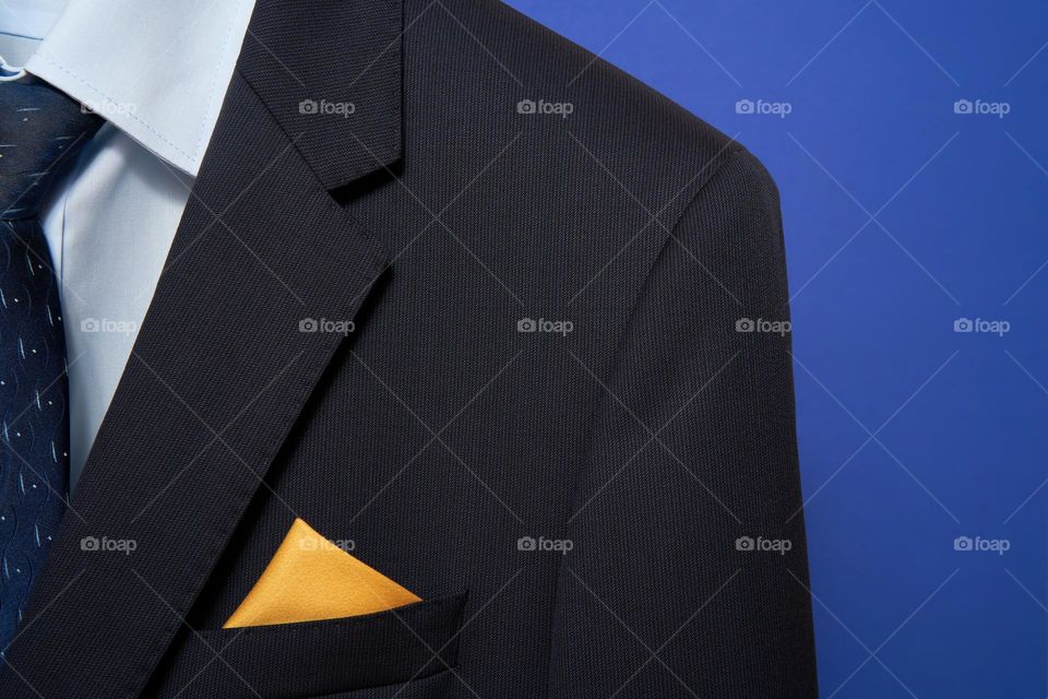 Navy jacket with yellow silk pocket square 
