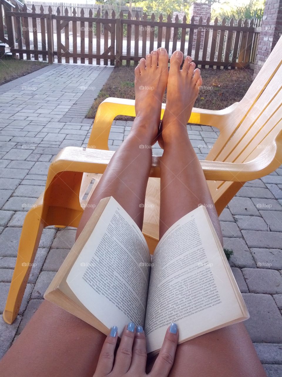 Relaxing, reading a book outside