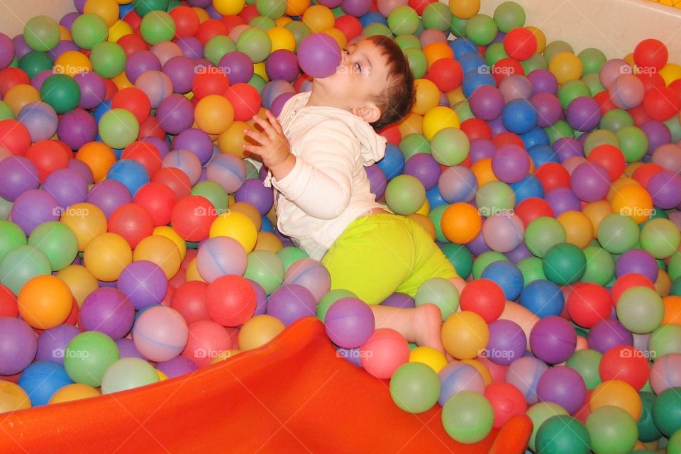 little boy playing balls