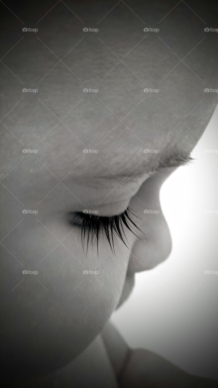 baby's beautiful eyelashes in black and white