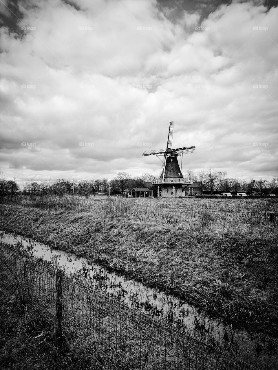 Vintage nostalgy: traditional Dutch landscape with windmill
