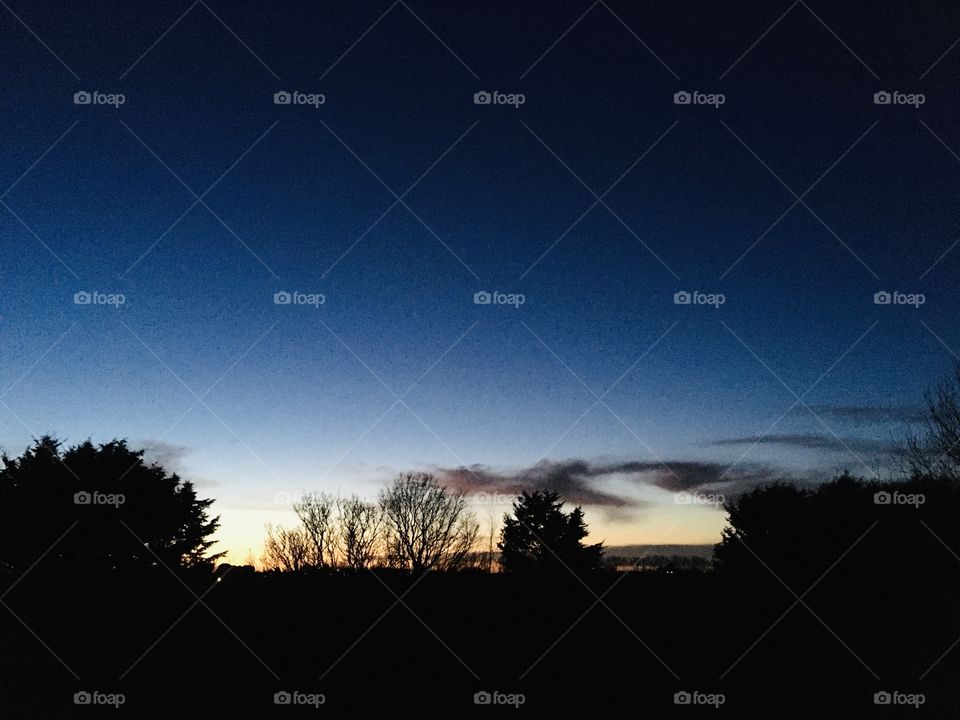 A beautiful sunset from my bedroom window this evening. This is a silhouetted English Countryside view.