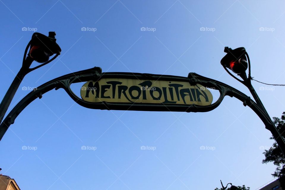 Old Metro sign in Paris, on an arch above the stairway down to the underground 