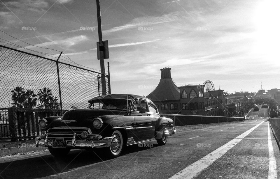 A rare look at a vintage car and no traffic on a California pier. 