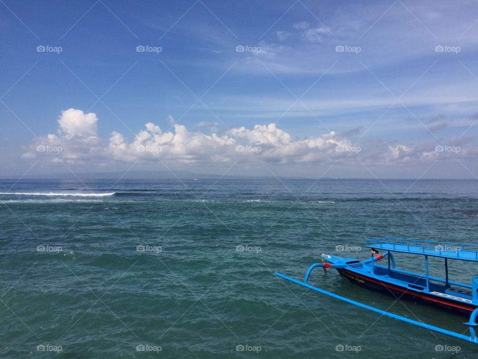 Taking a boat trip to go diving in bali