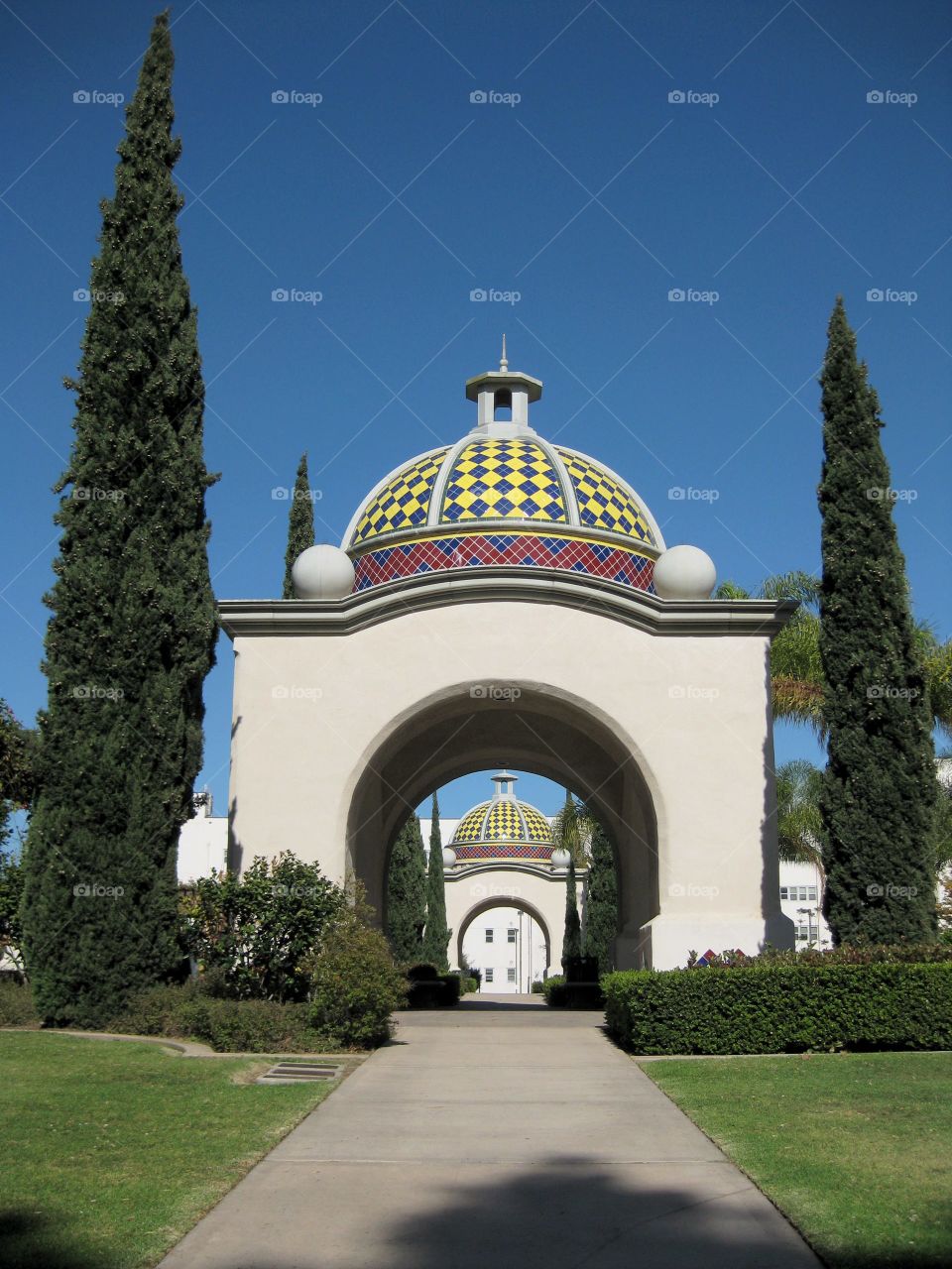 Perspective view of Mosaic domed structural architecture background of clear blue sky