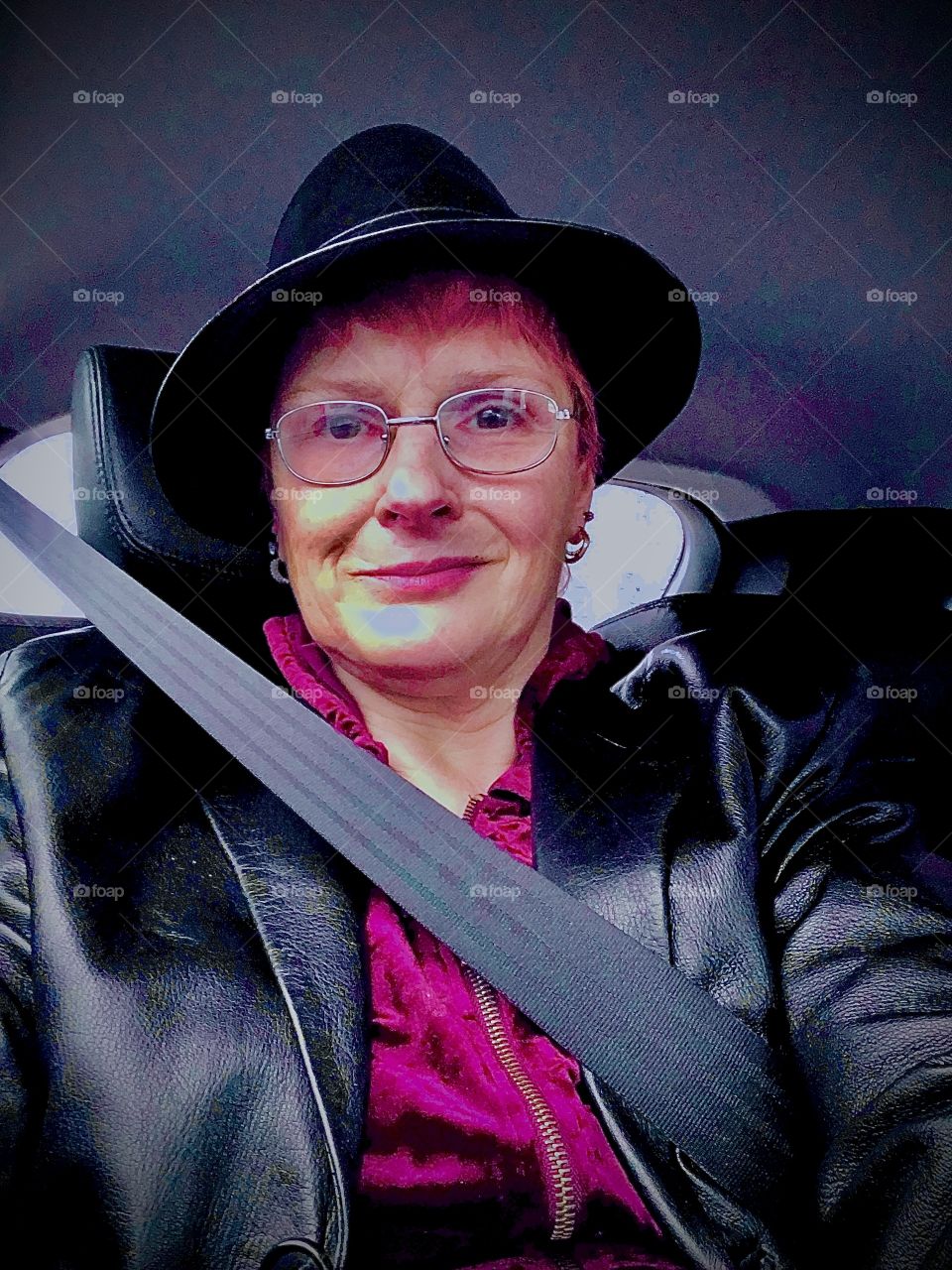 A self portrait riding in a car in transit somewhere between LIC, Queens and Forest Green, Bklyn wearing my black leather Fedora hat, a  red velvet hoodie and my leather jacket since it’s Fall going on winter in New York City..Hypnotic Prod. 2019. 