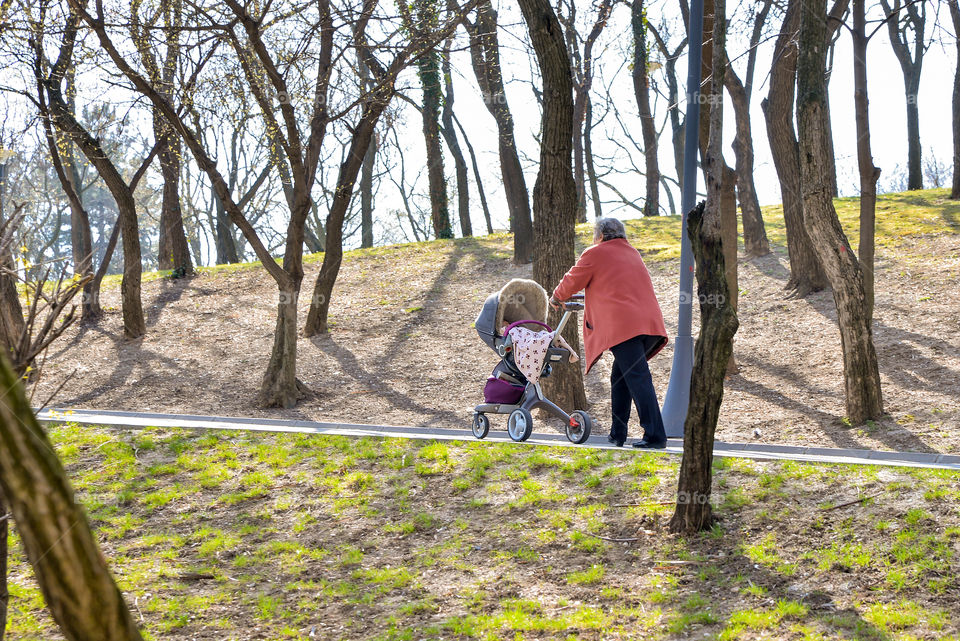 Grandma pushing a baby carriage