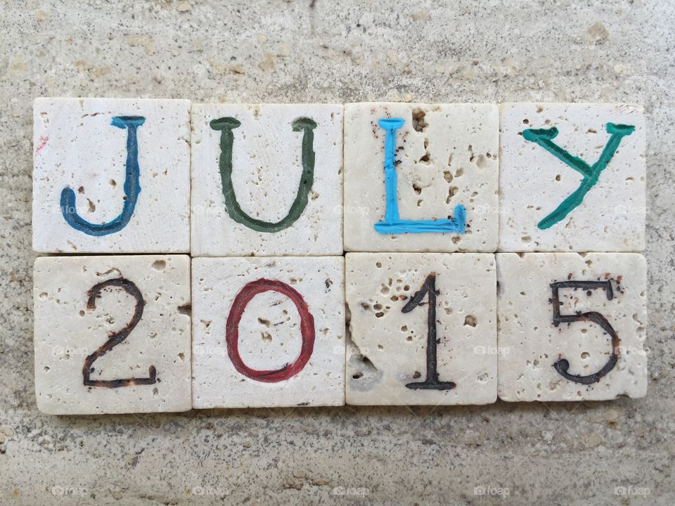 July 2015. Carved travertine pieces composition of the seventh month of the year, July 2015