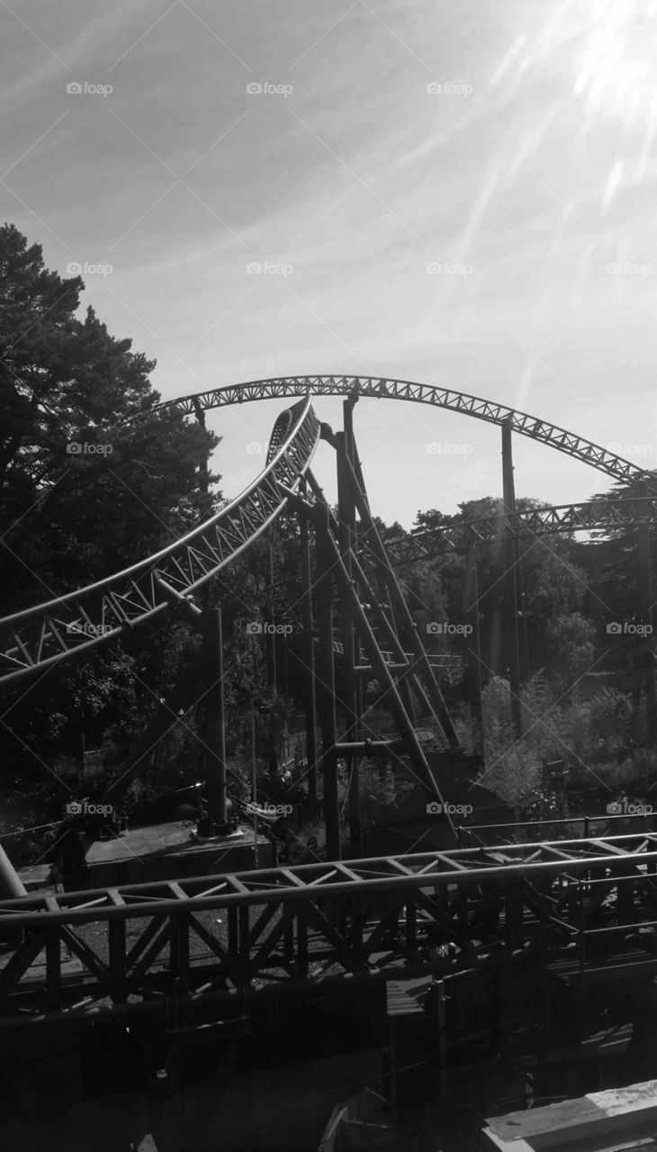 rollercoaster track with sky in black and white