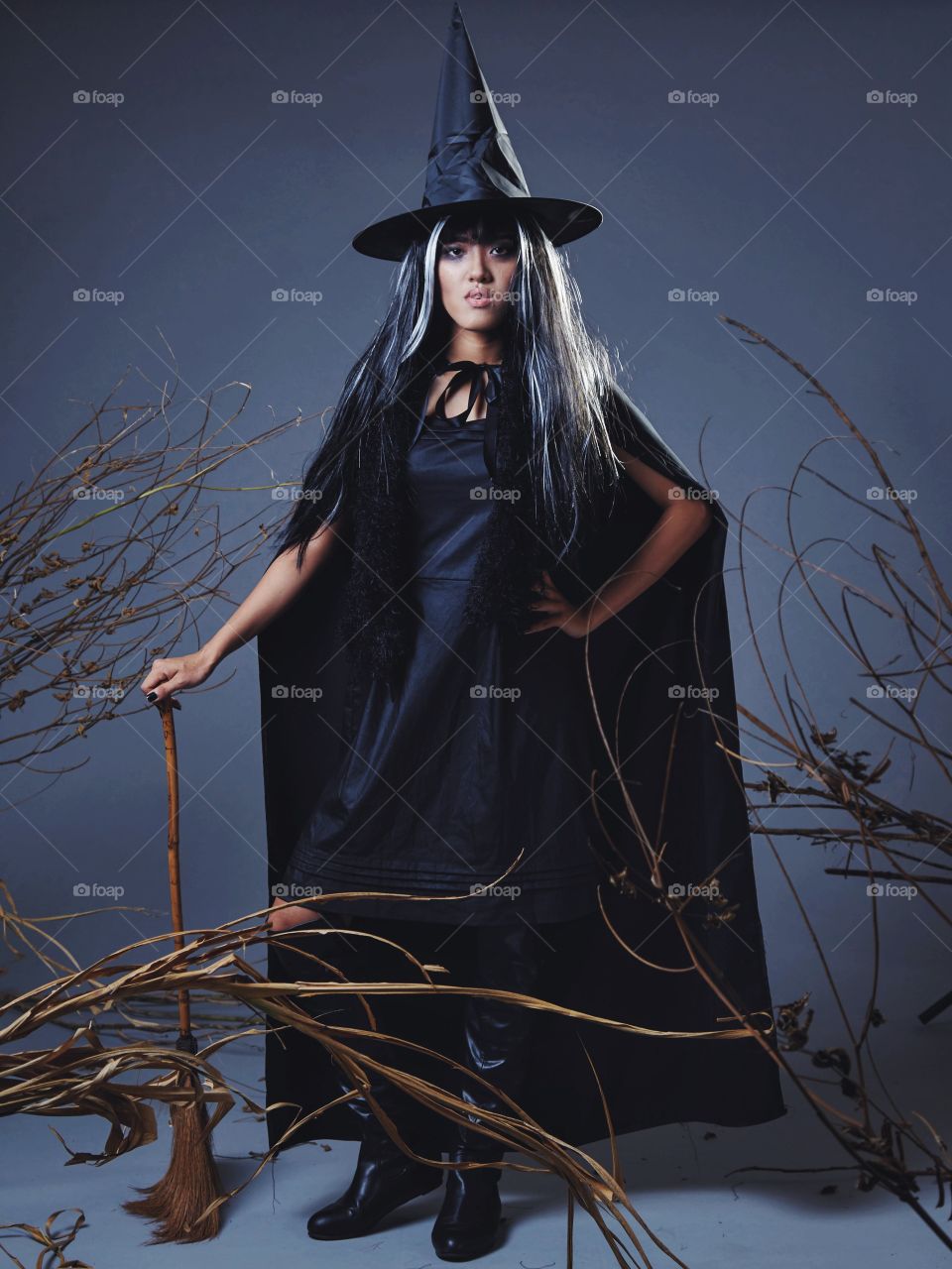 A girl in a witch costume 
