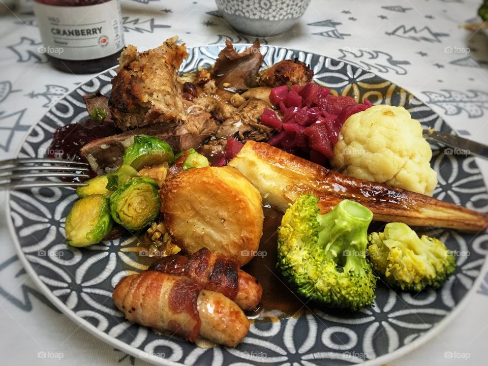 Goose, red cabbage, broccoli, parsnip, cauliflower, roasted chestnut and Brussels, pigs in blankets, roasties, stuffing hiding somewhere on the plate, cranberry sauce and gravy