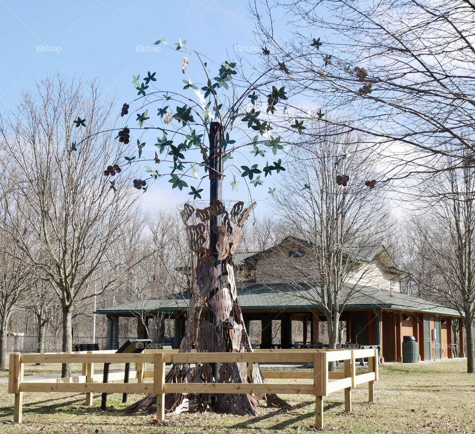 An art sculpture at the local park, of a whimsical tree. 