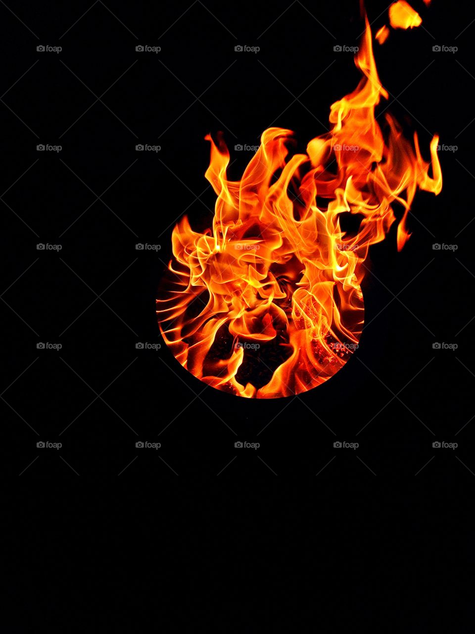 Burning flames against black background