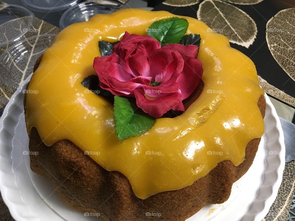 Close-up of donut with rose in plate