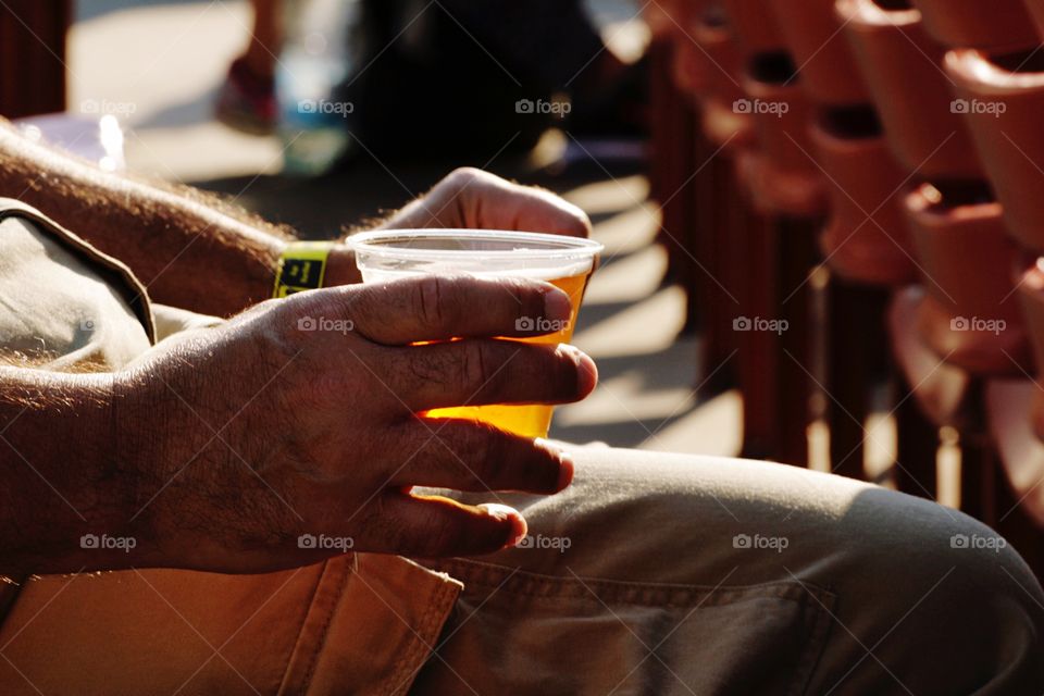 Holding alcoholic drink