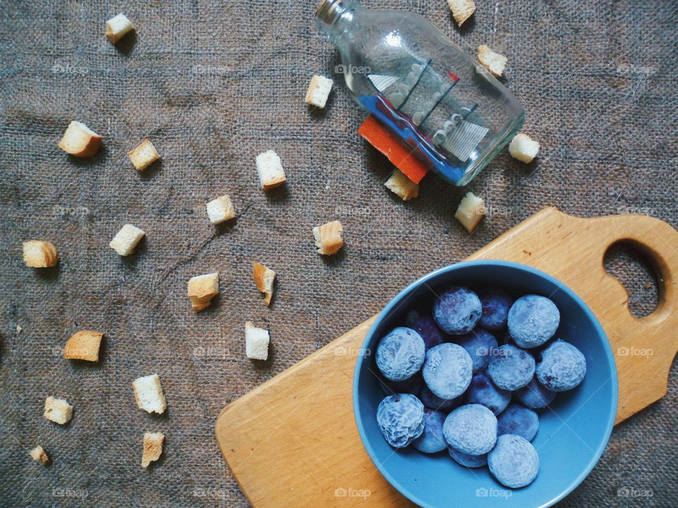 frozen plum and white crackers on the table