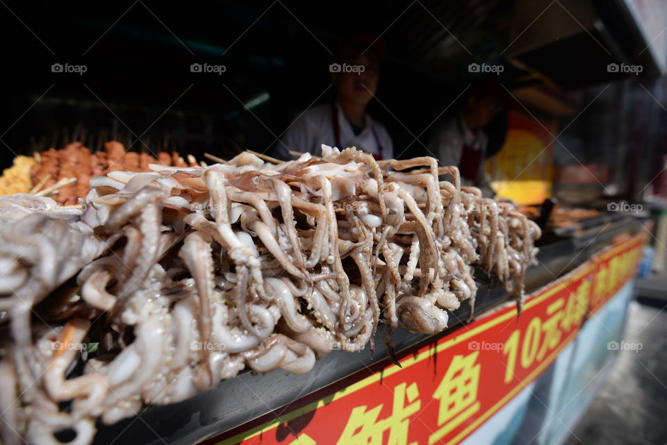 Asia, china streer food, outdoor, octopus. streer sellers
