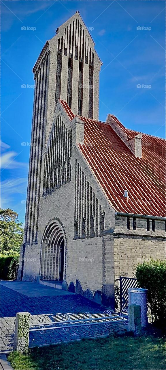 A church in the small „Danish“ town of „Gedsen“ that is close enough to be reached on a day trip from the former „East German“ county of „Vorpommern“, „Pommerania“ by the harbor town „Rostock“ by the „Baltic Sea“. 2022. Hypnotic Productions