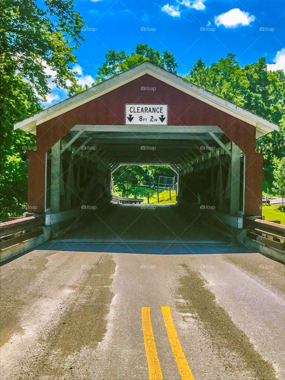 Front view of wooden covered bridge.