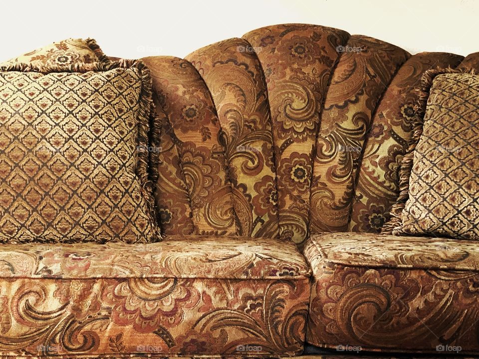 Cloth sofa with thrown pillows 