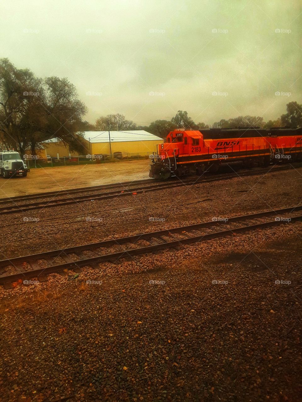 Orange  BNSF train on tracks