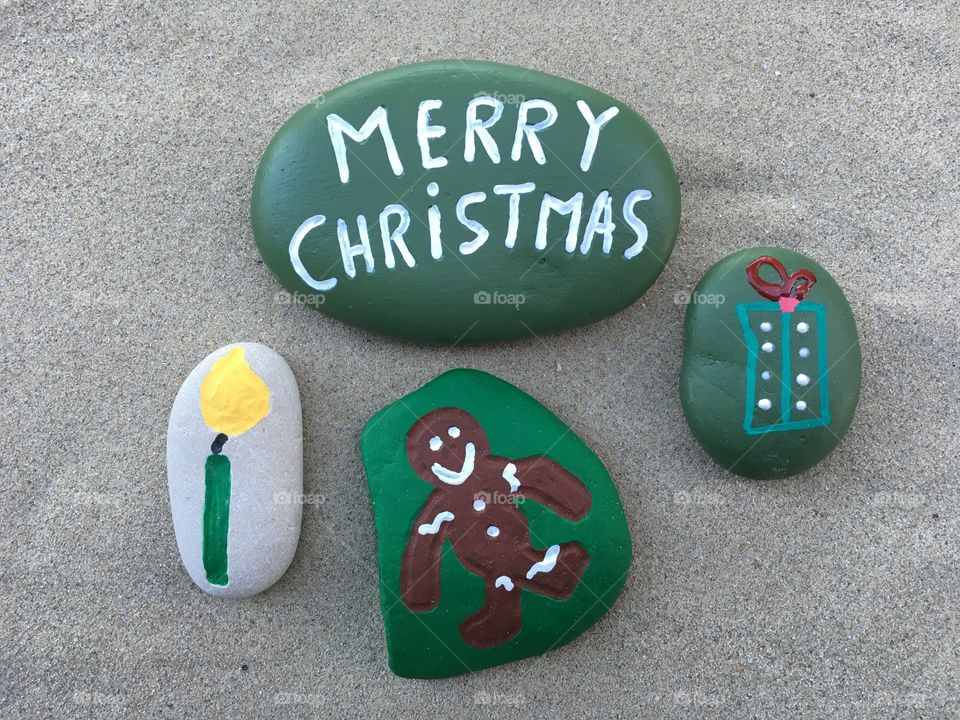 Merry Christmas hope message on green stones