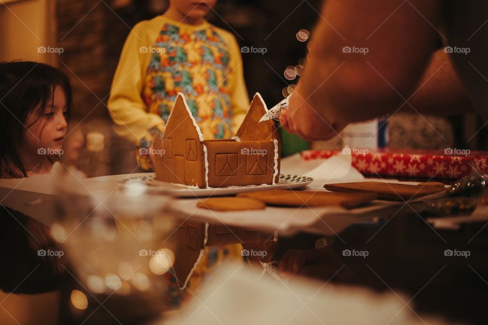 Making a gingerbread house.