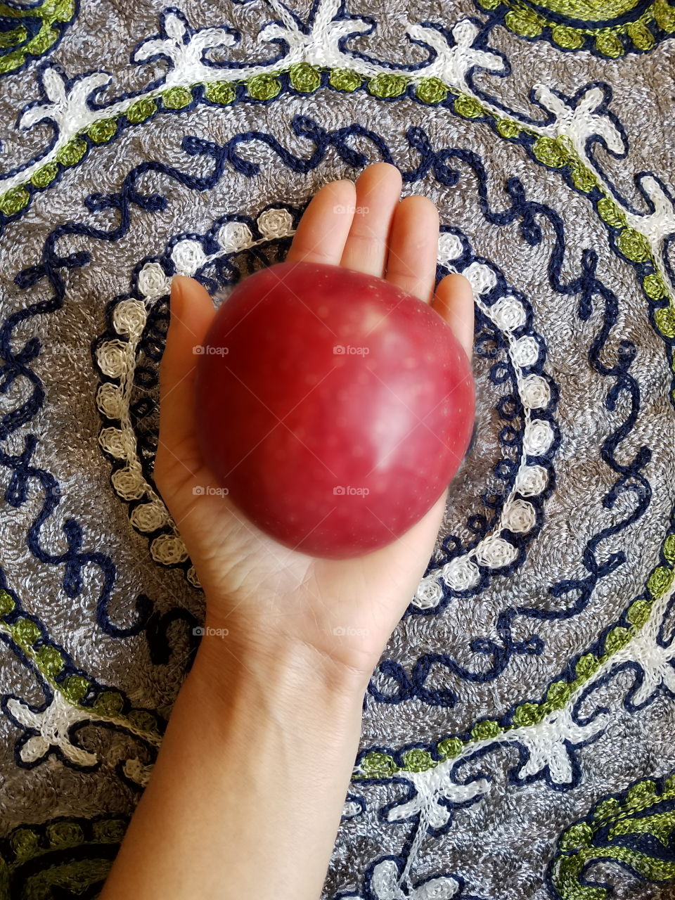 Holding apple