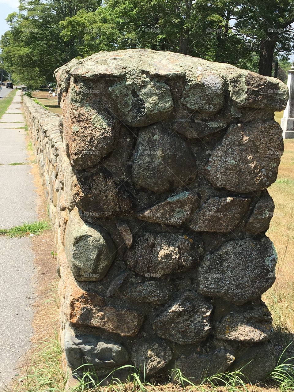 Start of Handmade Old Cemetery Wall made of Rocks.