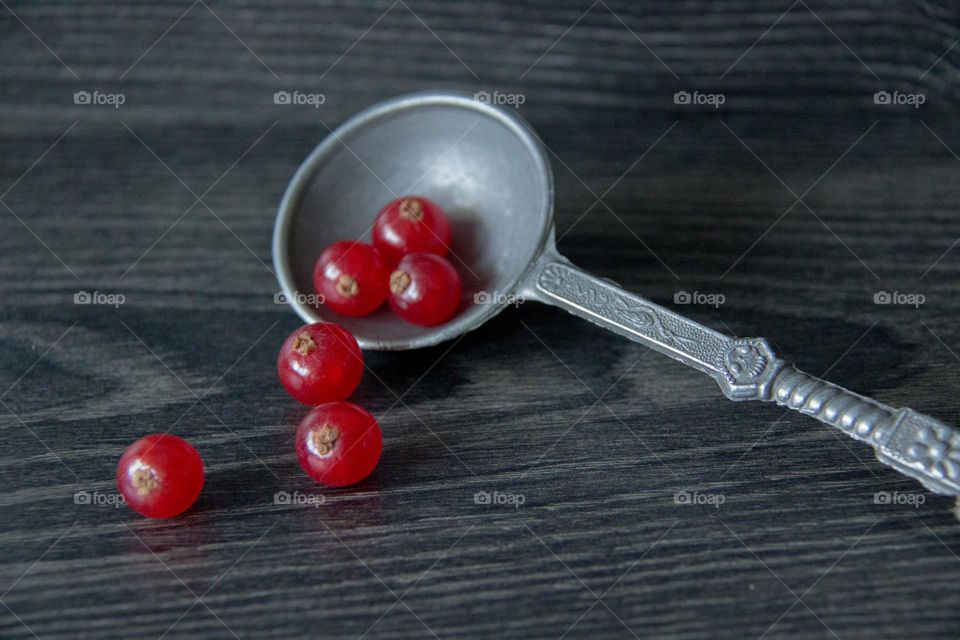 Red berries and spoon 