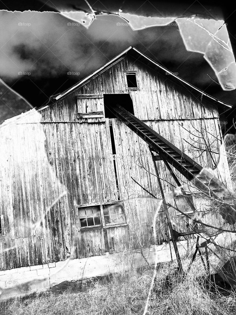 Rustic old barn thru broken glass