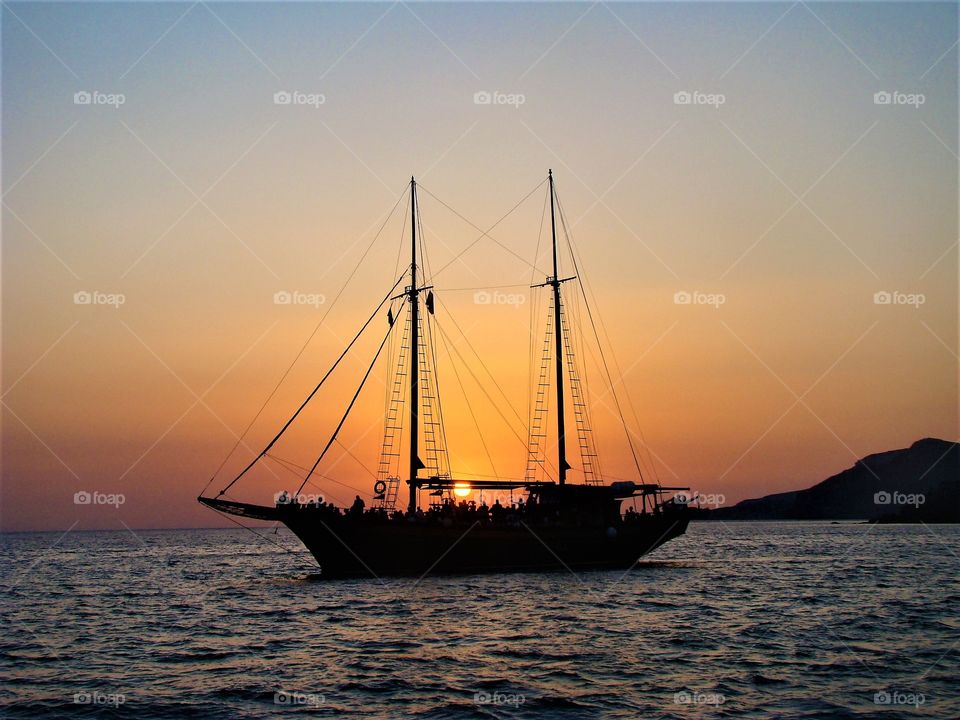 Sunset and yacht at sea