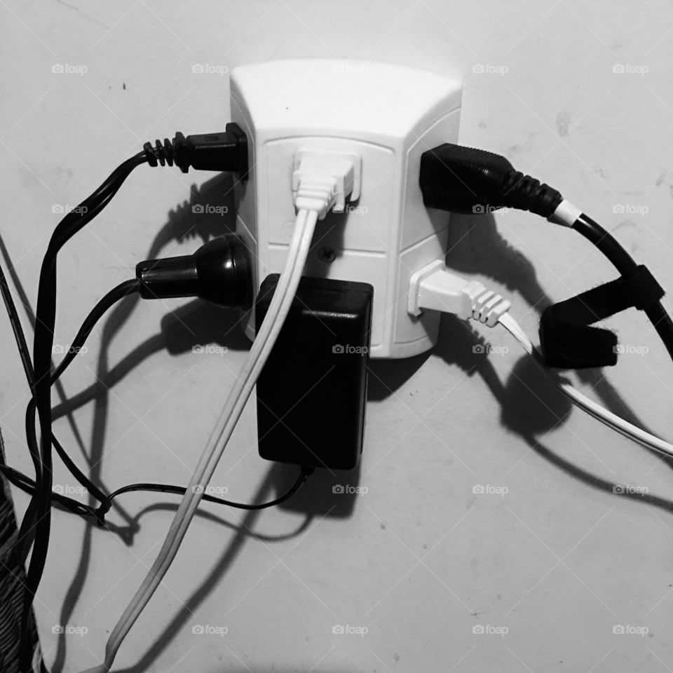 OVERLOADED ELECTRICAL OUTLET, What Not To Do!

I was somewhere that had this outlet with all these cords plugged into it. When nobody was around I quickly took this photo of it!