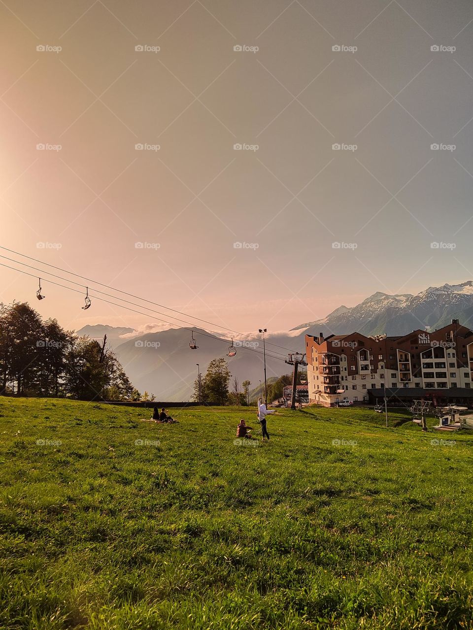 A green lawn on the background of mountains